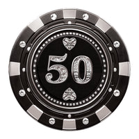 A luxury black and gold poker chip-style gift certificate with a $50 denomination, featuring gemstone details and a casino-inspired design.

