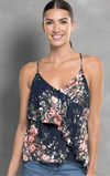 Navy floral asymmetrical ruffle tank top with adjustable straps, front layers, and an open tie-back detail.
