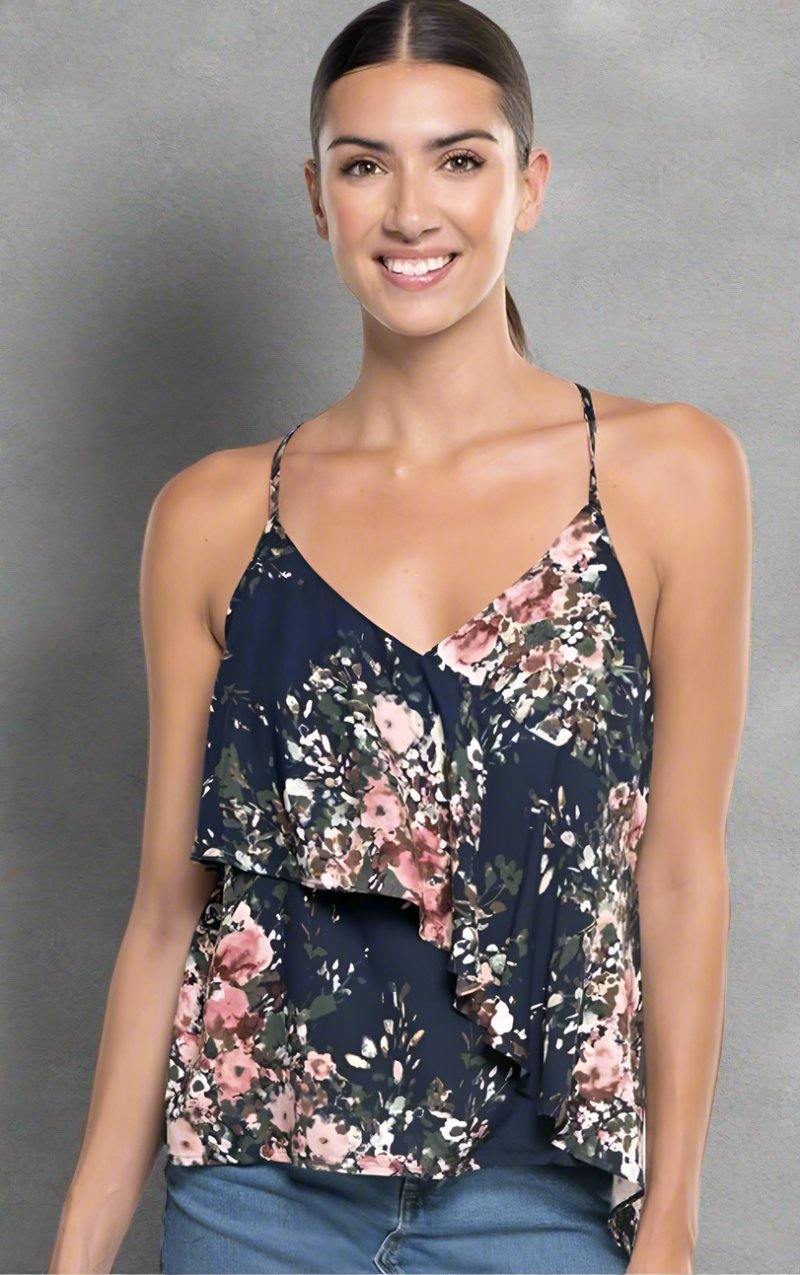 Navy floral asymmetrical ruffle tank top with adjustable straps, front layers, and an open tie-back detail.