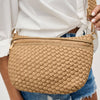 Eco-friendly woven crossbody bag made from recycled materials, featuring an adjustable strap and secure zipper compartments for hands-free convenience.