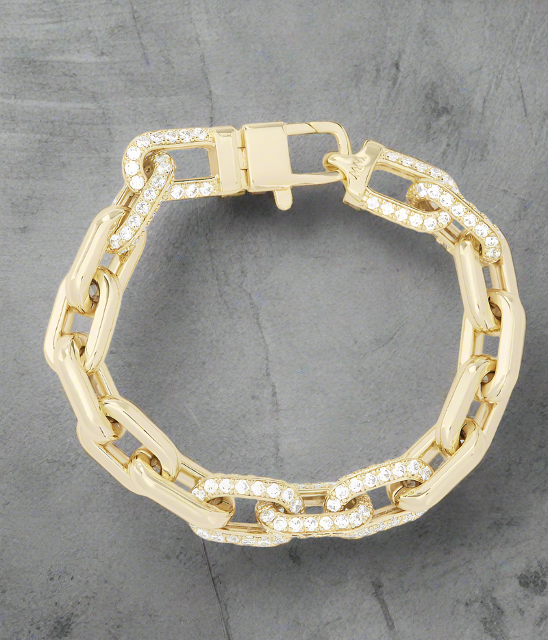 Gold chunky chain bracelet with pavé diamond links and clasp, styled in a circular layout