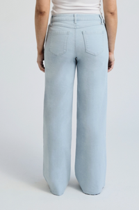 Light-wash wide-leg denim jeans featuring frayed seams, a high-rise fit, and raw hem details.

