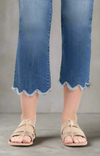 Cropped jeans with scalloped raw hems,  and sandals