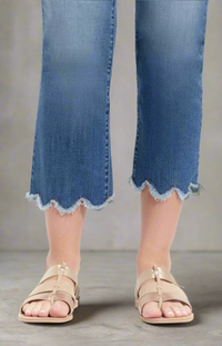 Cropped jeans with scalloped raw hems,  and sandals