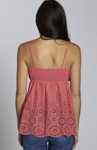 Coral pink eyelet cami with scalloped hem, adjustable straps, and smocked back detail.