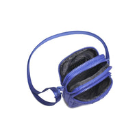 A stylish woven neoprene crossbody bag in a vibrant blue shade, featuring a compact design with multiple zippered compartments and an adjustable strap.
