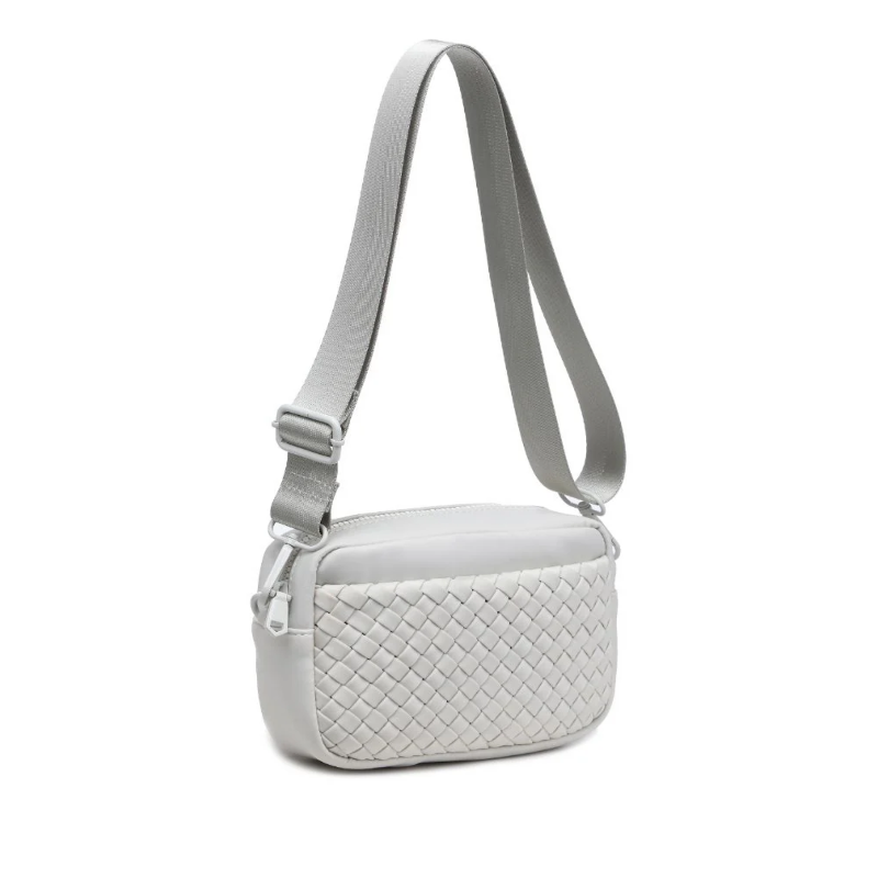 A sleek bone color woven neoprene crossbody bag with an adjustable strap, styled for a casual yet chic look.

