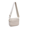 A sleek cream woven neoprene crossbody bag with an adjustable strap, styled for a casual yet chic look.

