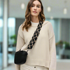 A black woven neoprene shoulder strap with adjustable length and metal clasps, designed to upgrade handbags or crossbody bags