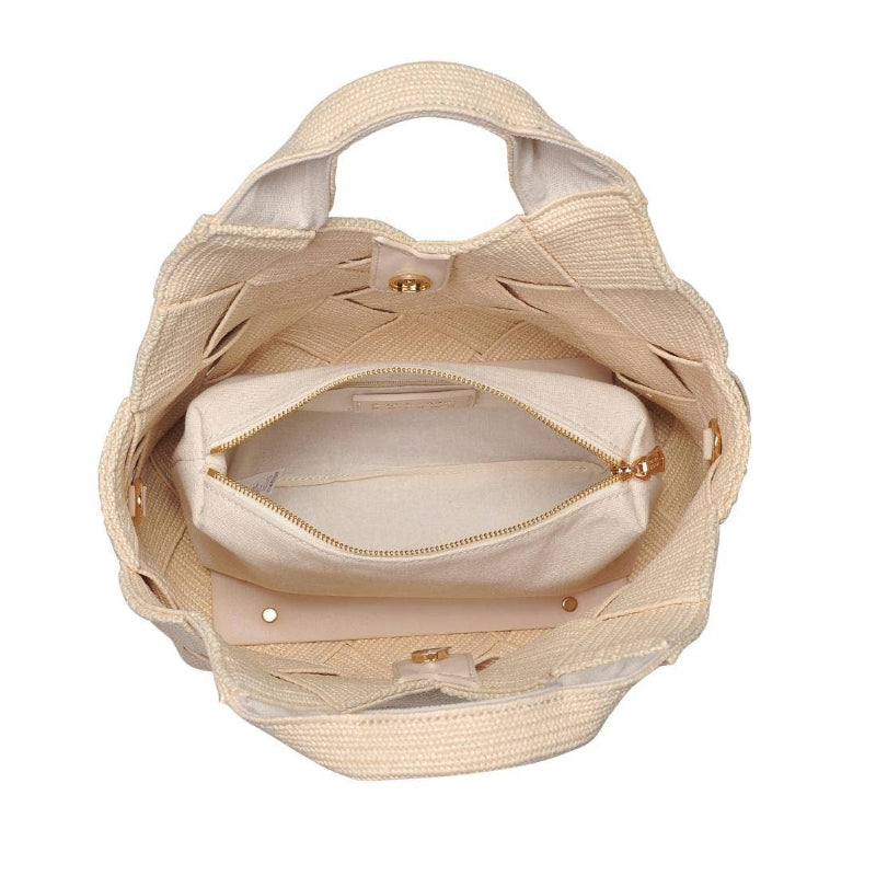 interior of a woven straw tote bag in a chic, summery design, featuring gold hardware and an adjustable strap