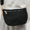 Eco-friendly black woven crossbody bag made from recycled materials, featuring an adjustable strap and secure zipper compartments for hands-free convenience.