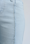 exposed frayed seams of wide-leg denim jeans