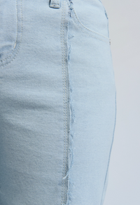 exposed frayed seams of wide-leg denim jeans